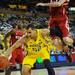 Michigan junior Jordan Morgan moves the ball around North Carolina State senior Scott Wood during the second half at Crisler Center on Tuesday night. Melanie Maxwell I AnnArbor.com